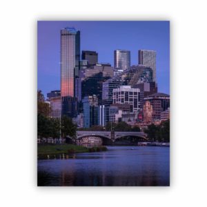 Photograph of Melbourne city in blue tone from the Yarra River view.