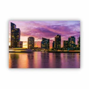 Sunset photo with buildings and the Melbourne star with pink and purple colours in the sky.