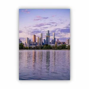 a purple tone photo of the Melbourne city at sunset with reflections on the river.