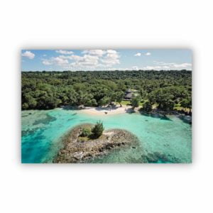 Aerial view photography in Black Pearl Resort Vanuatu showing the green forest and turquoise ocean.