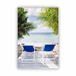Wall decor print of beach chairs facing a stunning beach view in Turtle bay Lodge.