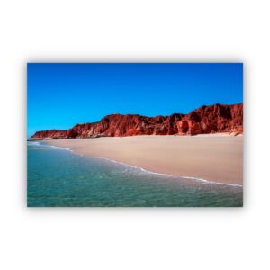 a stunning scenery in Cape Leveque Western Australia with blue sky, red rocks and ocean water.