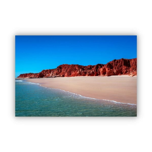 a stunning scenery in Cape Leveque Western Australia with blue sky, red rocks and ocean water.