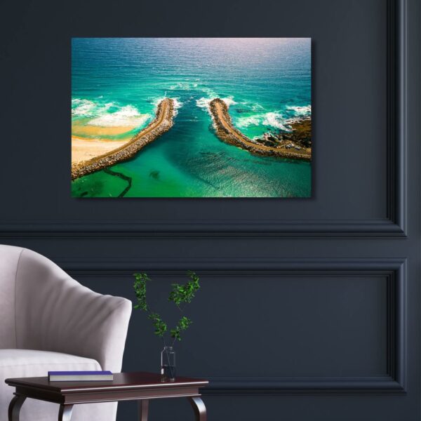 Aerial photograph of a beach in Narooma in blue green colours