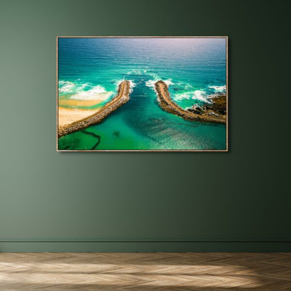 Aerial photograph of a beach in Narooma in blue green colours