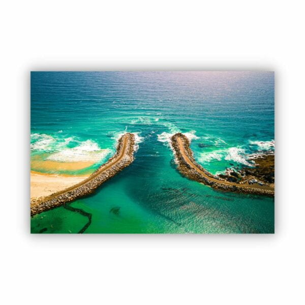 Aerial photograph of a beach in Narooma in blue green colours