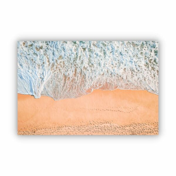 top view of strong waves coming onto the beach sand in Inverloch Victoria