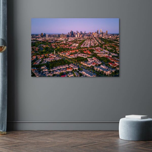 an aerial view over port melbourne during sunset creating a beautiful purple colour sky