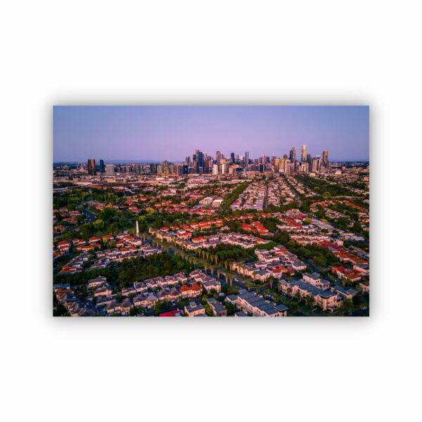 an aerial view over port melbourne during sunset creating a beautiful purple colour sky