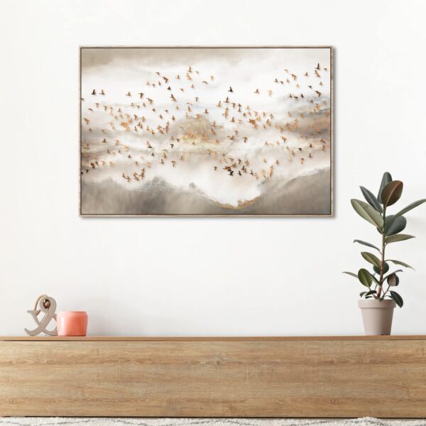 Canvas print of Flock of golden birds across the sky