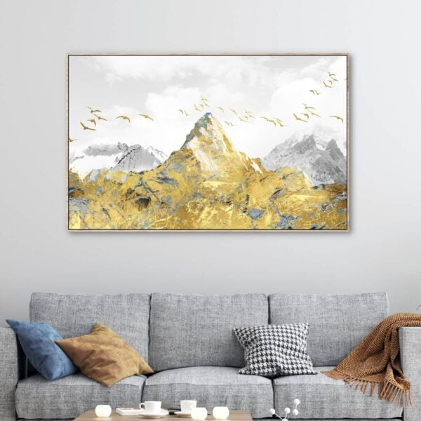 Beautiful canvas artwork of a golden mountain peak with golden birds flying around.