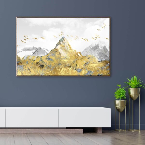 Beautiful canvas artwork of a golden mountain peak with golden birds flying around.